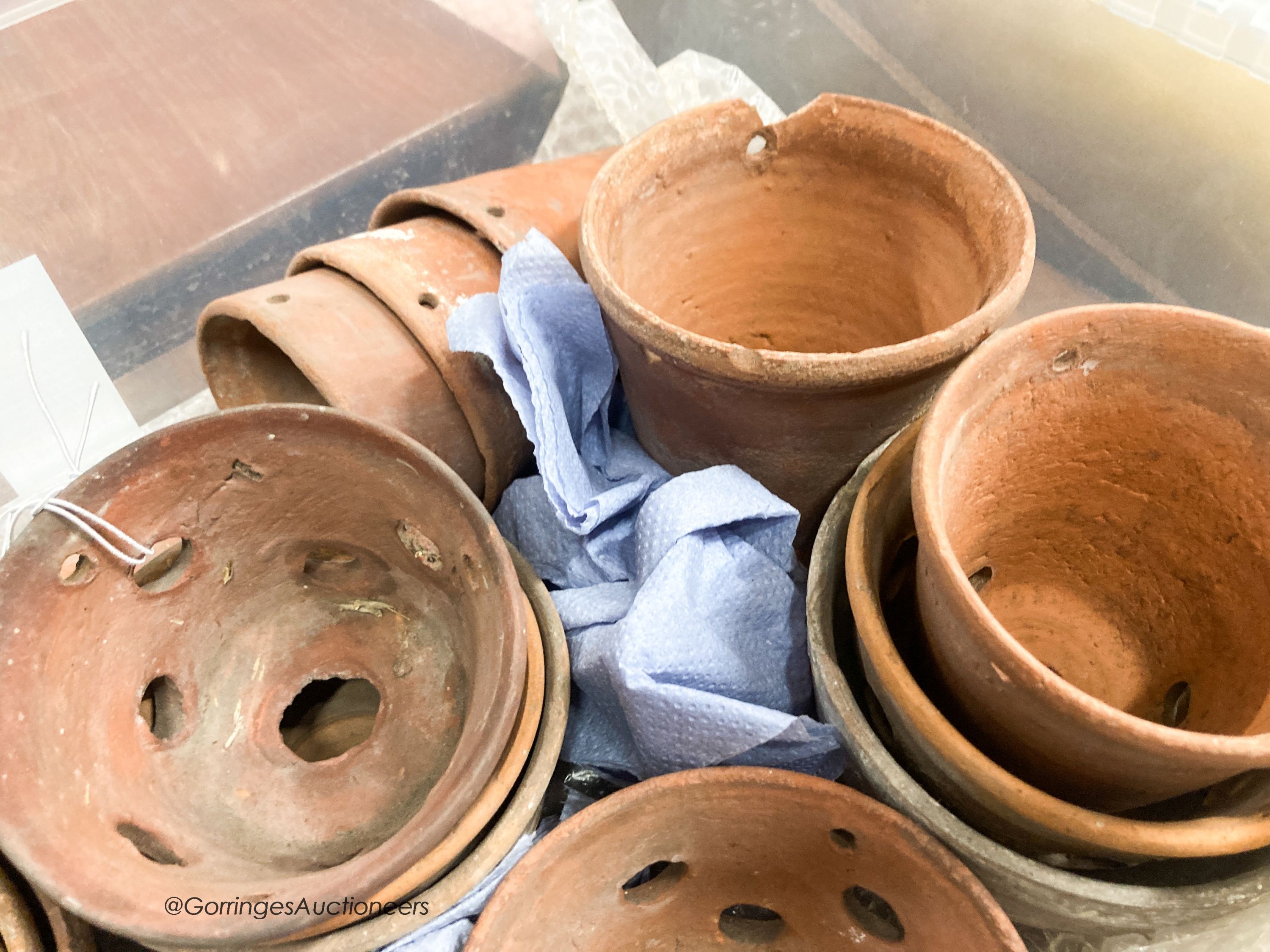 Approximately twenty six terracotta orchid pots, some stamped Sankey's Ltd, in assorted sizes, largest 12cm